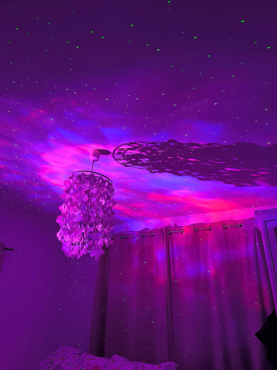 Hero banner featuring fuchsia nebula projections with green stars laser